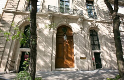 People walk by the Upper East Side New York estate of mulitmillionaire Jeffrey Epstein pm July 9