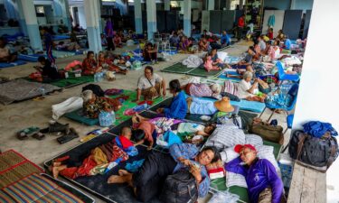 People rest at a shelter in Thailand's Surin province on July 24