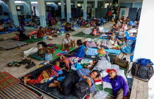People rest at a shelter in Thailand's Surin province on July 24
