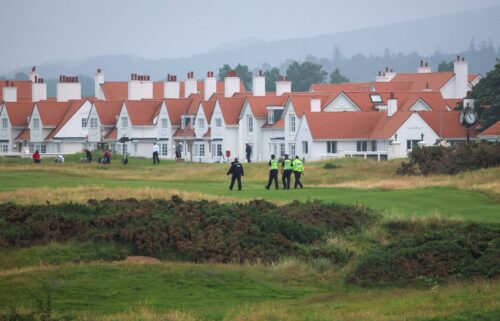 Police officers patrol on the Turnberry golf course ahead Trump's arrival on July 25.