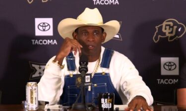 Colorado head coach Deion Sanders talks to reporters on July 28. Sanders said he has fought – and beaten – cancer after having his bladder removed