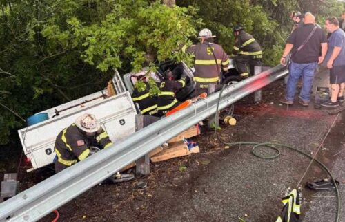 The driver was trapped inside the truck and needed to be extricated by rescue crews.
