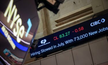 A news ticker broadcasts jobs report news on the floor of the New York Stock Exchange in New York