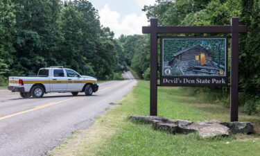 An Arkansas Park Ranger patrols the south entrance of Devil's Den State Park Monday