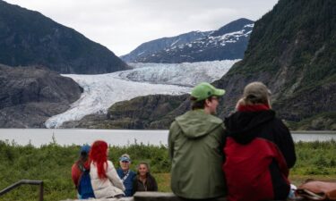 People view Mendenhall Glacier from the Mendenhall Glacier Visitors Center area