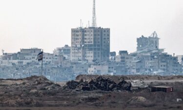 A damaged Israeli flag stands in Gaza