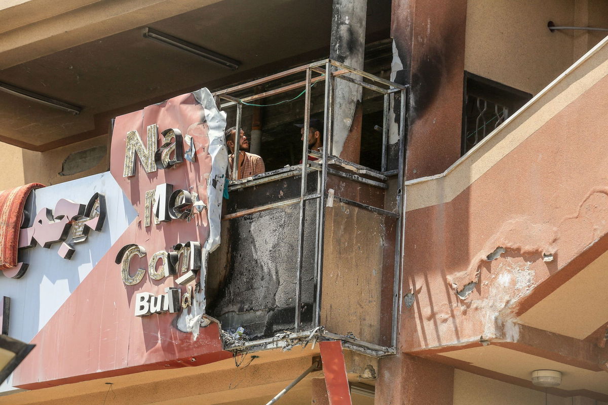 <i>Abed Rahim Khatib/Anadolu/Getty Images via CNN Newsource</i><br/>People look at the damage to Nasser Medical Complex in Khan Younis