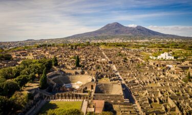 An aerial view of Pompeii is pictured with Mount Vesuvius in the background.