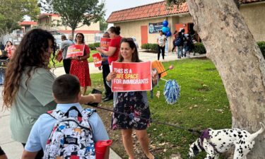 Teachers greet families outside Brooklyn Avenue School in Los Angeles on August 14.