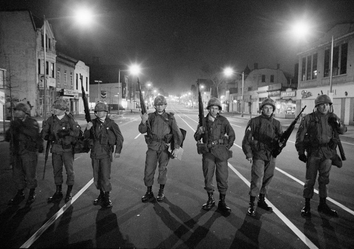<i>Bettmann Archive/Getty Images via CNN Newsource</i><br/>Troops patrol a downtown street in Washington