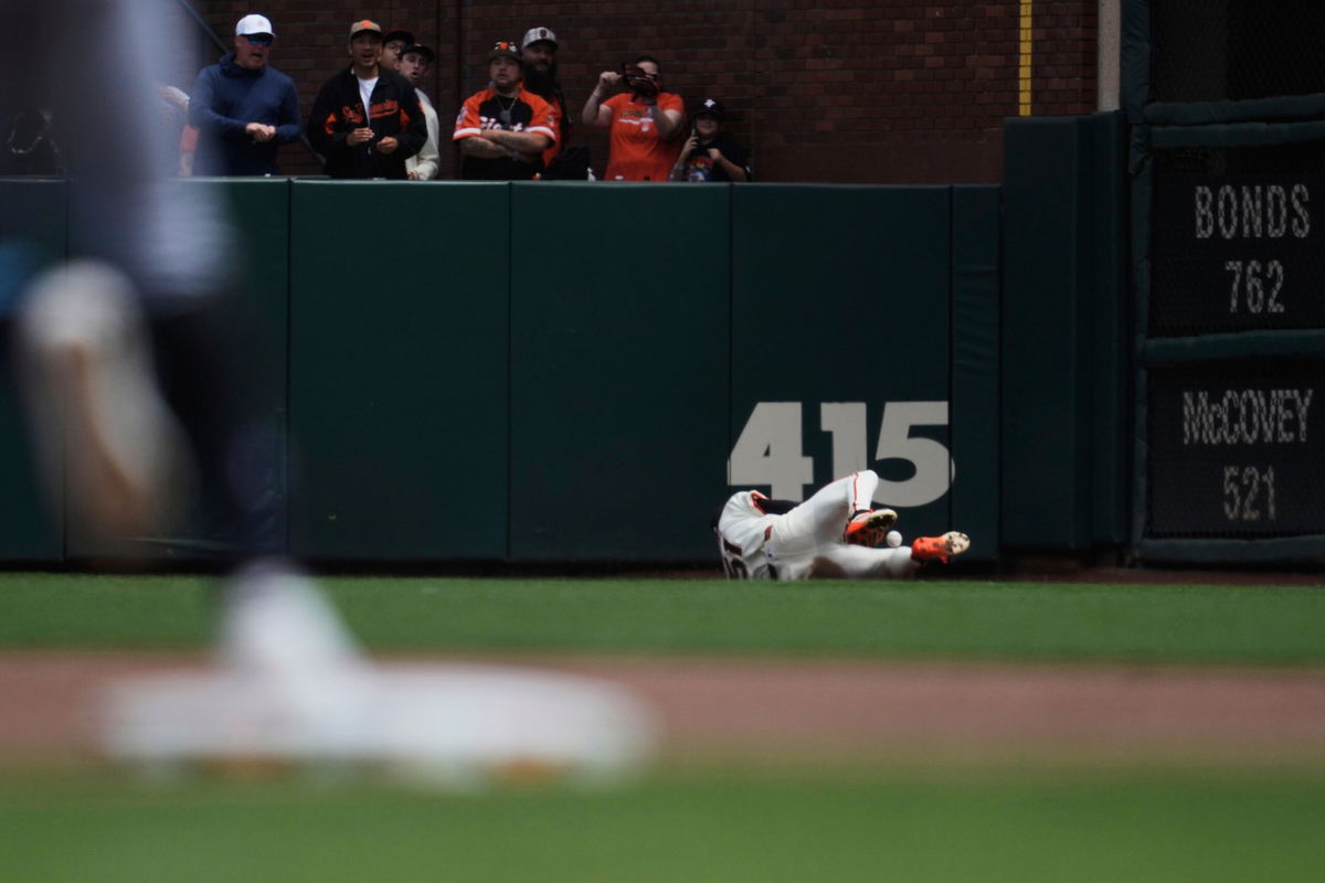 <i>Jeff Chiu/AP via CNN Newsource</i><br/>Jung makes the catch in the fourth inning.