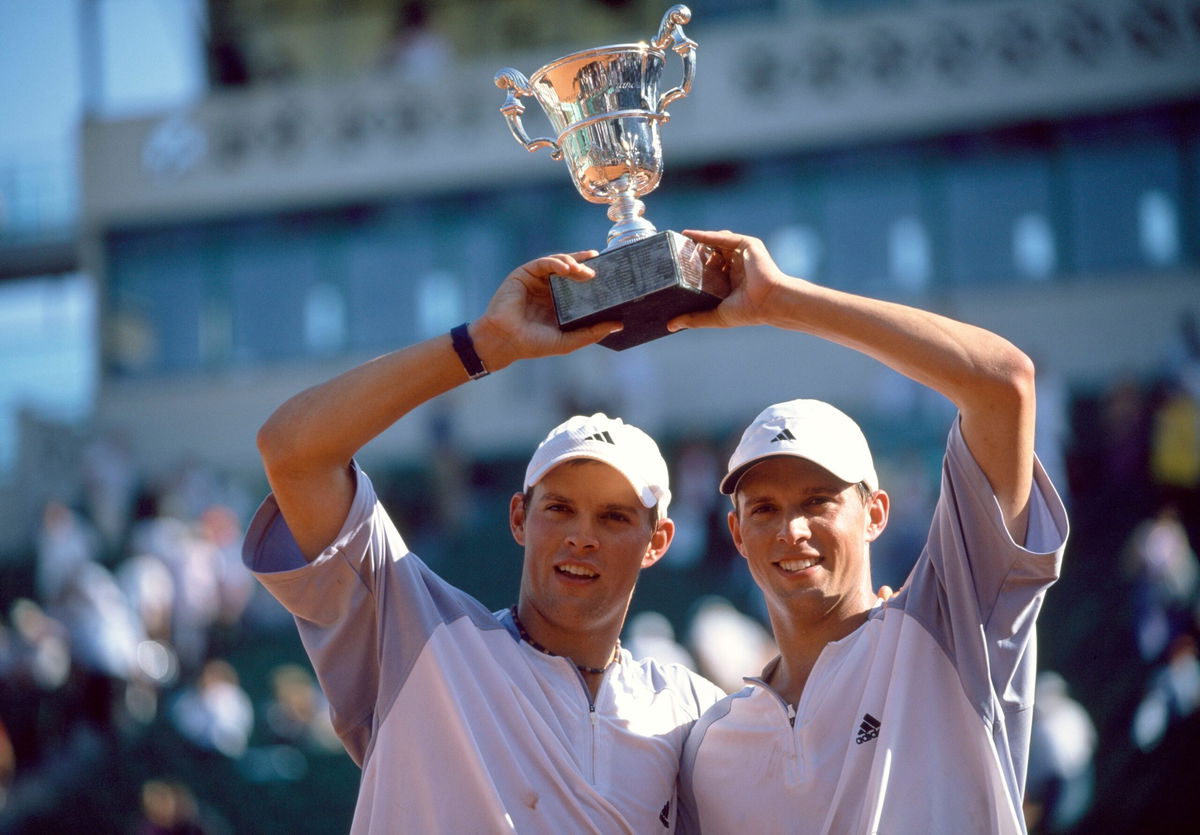 <i>Professional Sport/Popperfoto/Getty Images via CNN Newsource</i><br/>Michael Bryan and Bob Bryan lift the trophy after their win in the men's doubles final of the French Open in 2003.