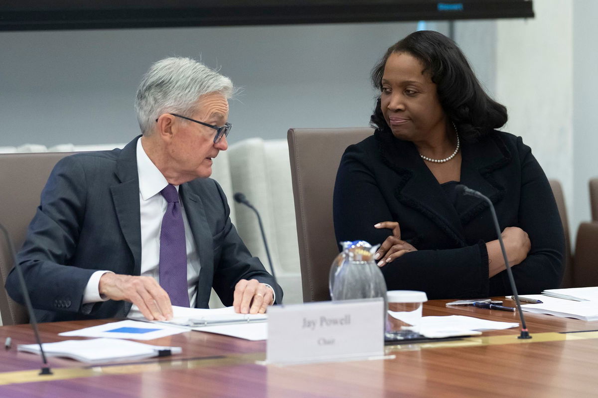 <i>Mark Schiefelbein/AP via CNN Newsource</i><br/>Federal Reserve Chair Jerome Powell speaks with Lisa Cook during a Board of Governors meeting on June 25 in Washington.