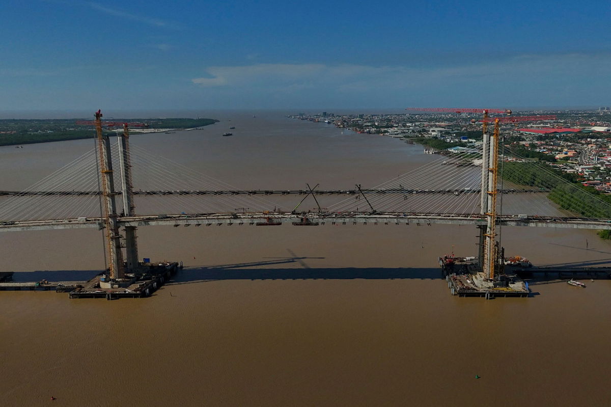 <i>Joaquin Sarmiento/AFP/Getty Images via CNN Newsource</i><br/>This aerial view shows the New Demerara river bridge under construction in Georgetown on August 26.