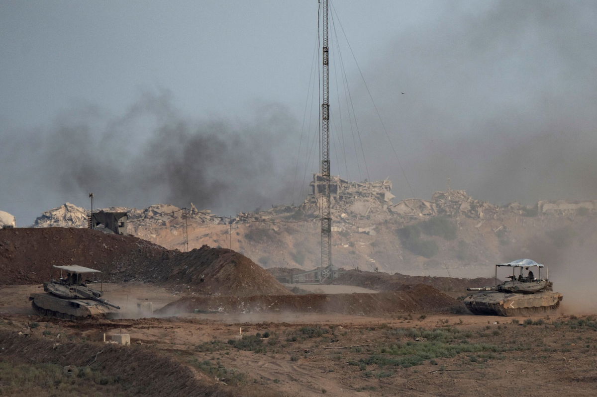<i>Maya Levin/AFP/Getty Images via CNN Newsource</i><br/>Tanks move inside Gaza