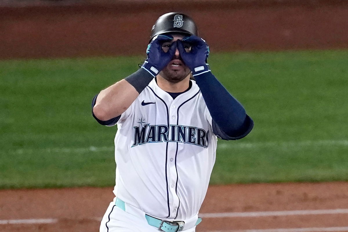 <i>David J. Phillip/AP via CNN Newsource</i><br/>Eugenio Suárez rounds the bases after hitting one of the biggest home runs in Seattle Mariners history.