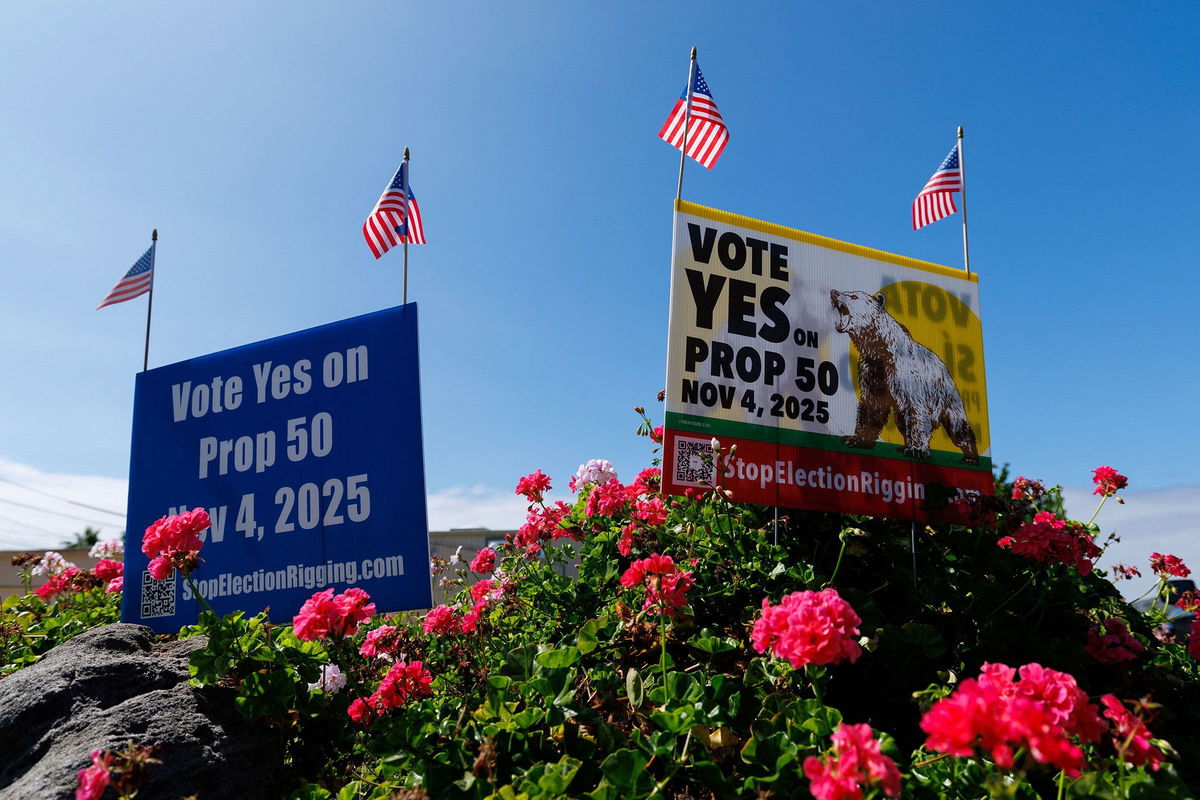 <i>Mike Blake/Reuters via CNN Newsource</i><br/>Signs supporting Proposition 50
