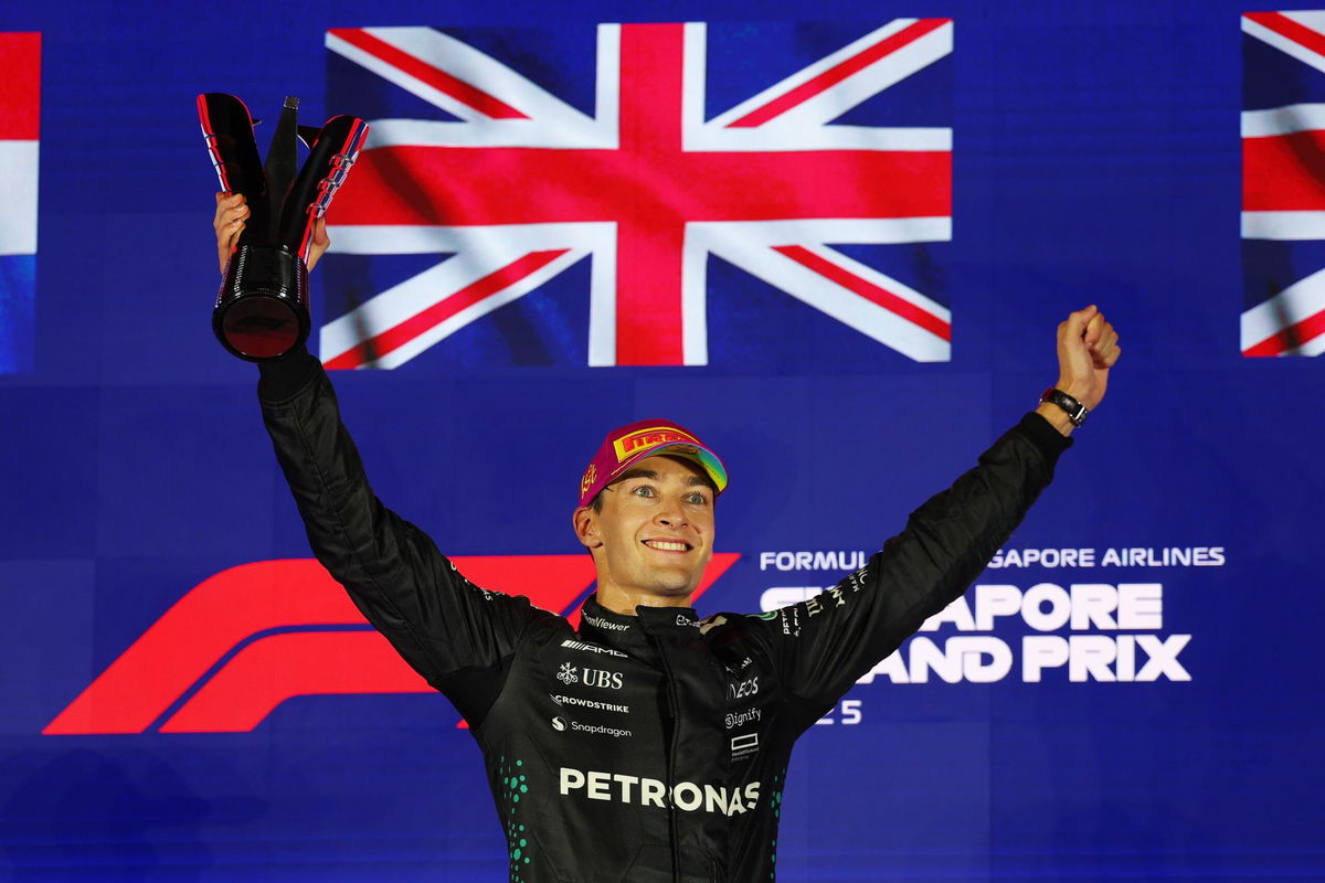 <i>Clive Rose/Getty Images via CNN Newsource</i><br/>George Russell of Great Britain celebrates on the podium during the F1 Grand Prix of Singapore at Marina Bay Street Circuit.