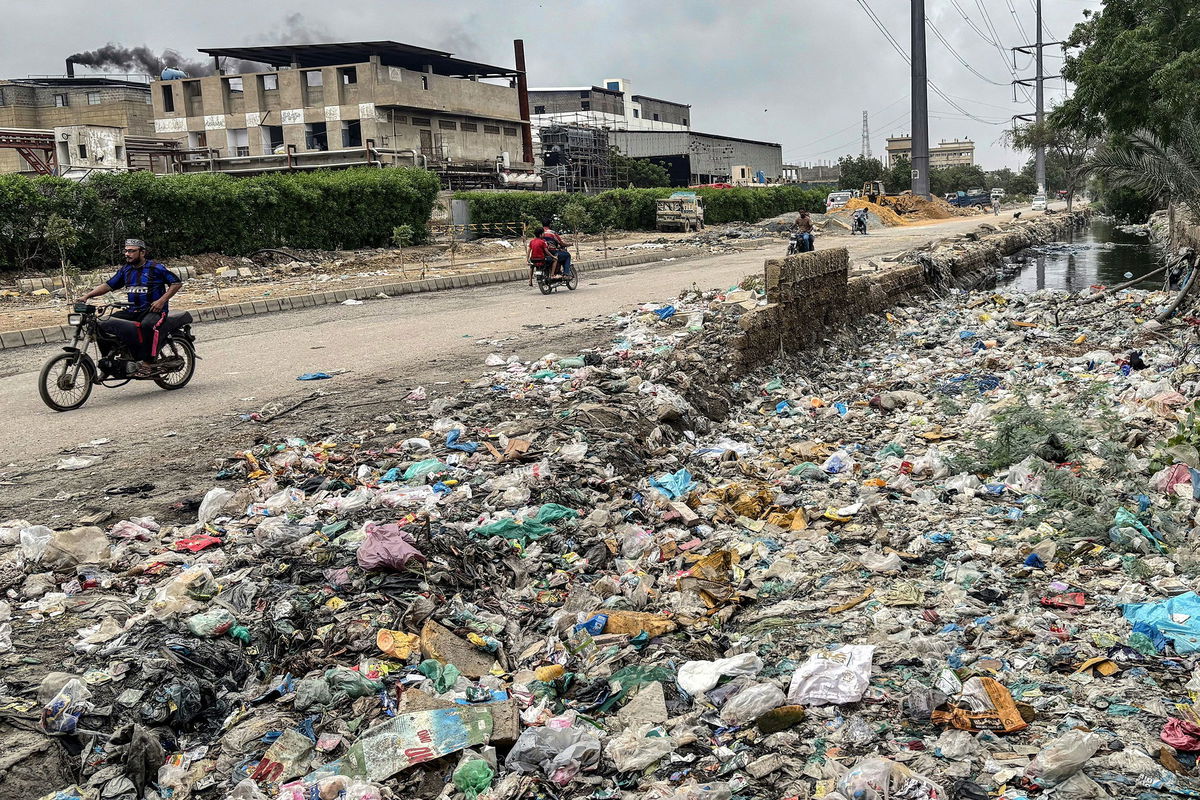 A drainage ditch clogged with plastic waste after monsoon flooding in Pakistan in August.