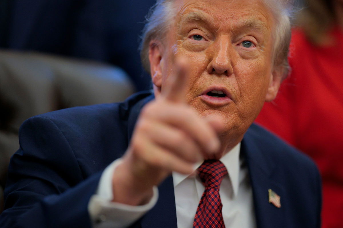President Donald Trump takes questions from the press in the Oval Office on Wednesday.